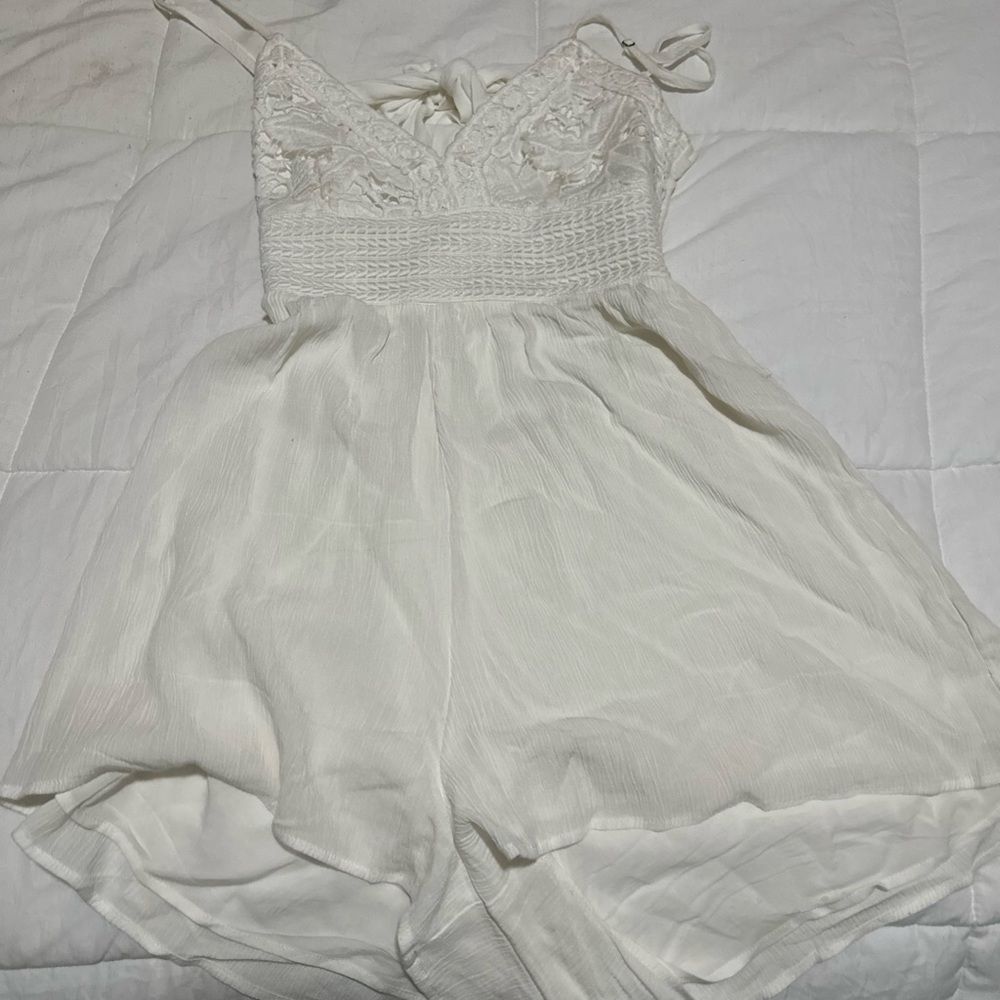 white romper with pattern on top half